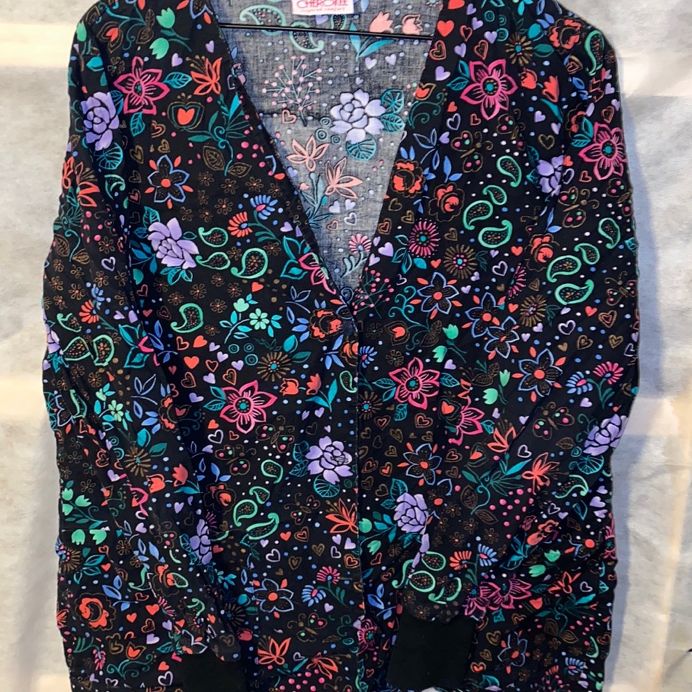 Cherokee button up Scrub Jacket with adjustable tie back.